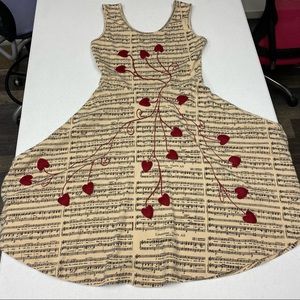 Effie’s Heart flare tank dress with music and hearts, tan color, size M
